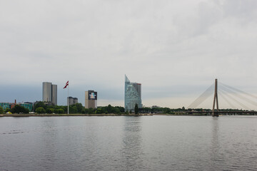 Naklejka premium Riga, Latvia - 11-06-2019: Riga river bank on a cloudy day, Latvia