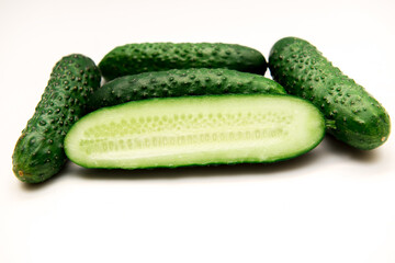 Fresh green cucumbers isolated on white background
