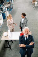 Portrait of handsome businessman. Man working in factory.