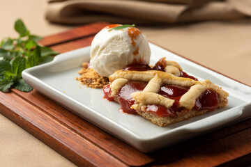 guava pie with vanilla ice cream on white plate