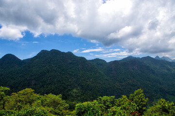 Mountain view and blue sky with beautiful white clouds.