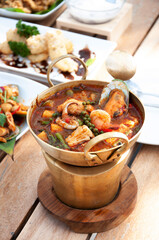 Thai hot and spicy seafood curry with vegetable and herbs or Kaeng Pa