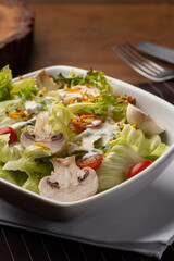 lettuce mushroom tomato salad on bowl