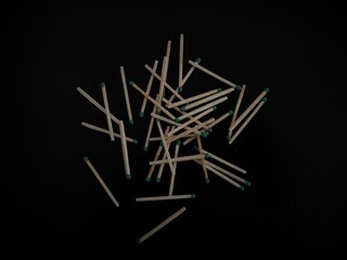 matches scattered on a black table