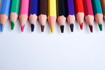 Close up color pencils isolated on white background space for text.
