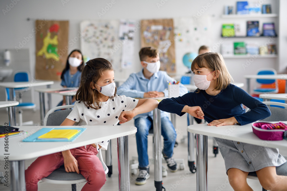 Poster children with face mask back at school after covid-19 quarantine and lockdown, greeting.