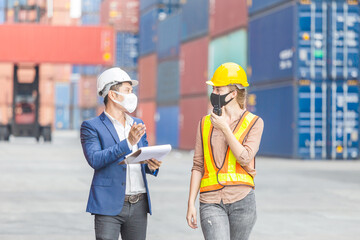 Engineer and foreman checking containers box from cargo, Worker team wearing protection face mask against coronavirus