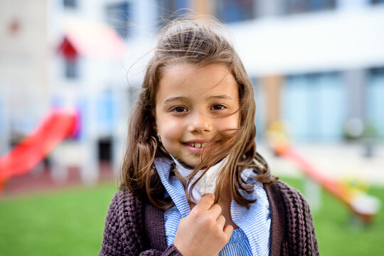 Portrait Of Happy Child With Face Mask Going Back To School After Covid-19 Lockdown.