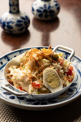 cod fish bacalhau with rice, onions eggs olive oil - portuguese traditional food