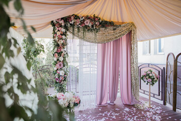 arch for a wedding ceremony with flowers