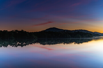 Soft and Light High Cloud Sunrise over the Bay