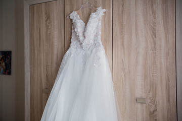 Fototapeta na wymiar bride wedding dress on the closet in the room