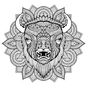 Bull. Bison. Coloring is hand-drawn in the style of Zentangle, Doodle. Full face illustration animal's head black lines on a white background. Ethnic ornaments Indian, Mexican. Vector background