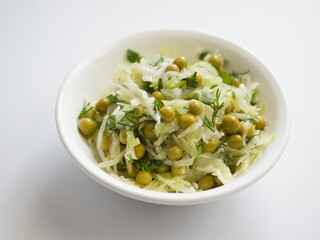 Salad of fresh cabbage, peas and greens. Vegetable dish