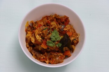 Baigan Bharta or Vangyache Bharit, a roasted and mashed eggplant fry or curry, favourite maharashtrian curry, served in a bowl, Indian traditional food