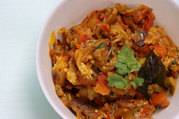Baigan Bharta or Vangyache Bharit, a roasted and mashed eggplant fry or curry, favourite maharashtrian curry, served in a bowl, Indian traditional food