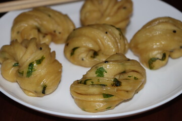 Steamed bread, typically made from wheat, prepared by steaming 