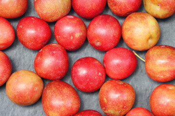 Fresh plum fruits on black background