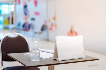 Clear alcohol gel bottles for hand cleaning to prevent the spreading of the corona virus (Covid-19). Place the entrance service with register book for customers before buying in the supermarket.