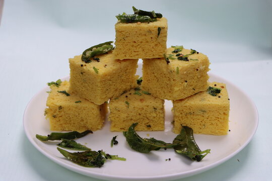 Dhokla, breakfast or snack mainly in Indian states Gujarat and maharashtra, made with a fermented batter derived from rice and split chickpeas