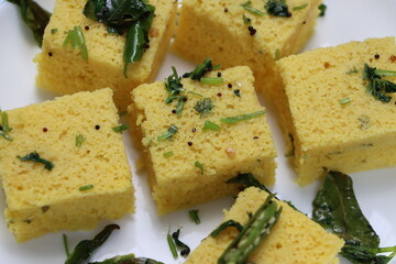 Dhokla, breakfast or snack mainly in Indian states Gujarat and maharashtra, made with a fermented batter derived from rice and split chickpeas