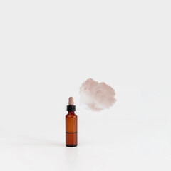 Natural cosmetic bottle on gray background with cloud. New normal concept. Balancing composition...
