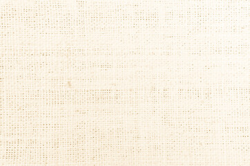 Jute hessian sackcloth canvas woven texture pattern background in light beige cream brown color blank empty