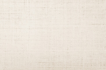 Jute hessian sackcloth canvas woven texture pattern background in light beige cream brown color blank empty
