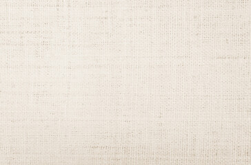 Jute hessian sackcloth canvas woven texture pattern background in light beige cream brown color blank empty