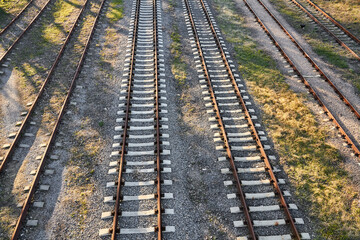 Rusty railroad tracks on gravel. Top view.