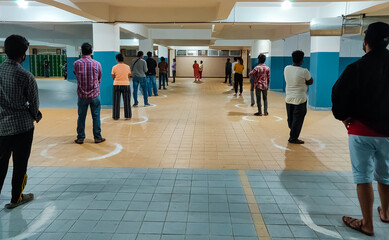 People Practice Social Distancing Outside Grocery Store. Customers Standing Inside Circle At two meters Distance To Prevent The Spread Of COVID-19