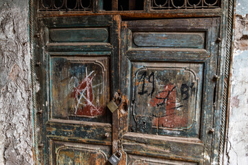 Old door with rusty lockers 