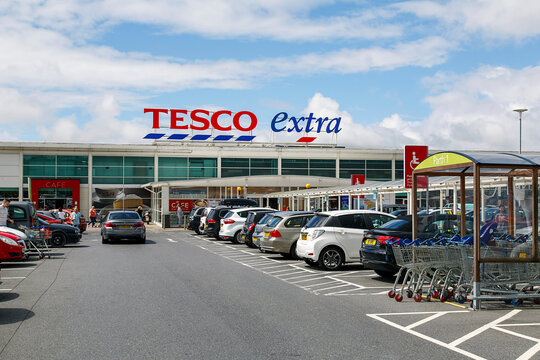Swansea, UK: July 09, 2017: Front view of a Tesco Extra Superstore in Wales. Tesco PLC is a British multinational grocery and general merchandise. 