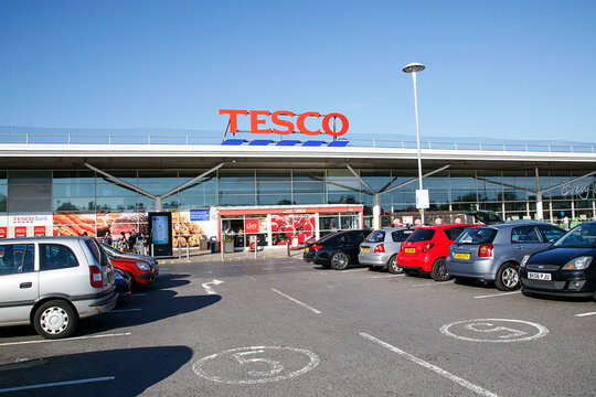 Llanelli, UK: September 21, 2018: Customers enter a Tesco Extra superstore. Tesco is a British multinational groceries and general merchandise retailer. It is the third-largest retailer in the world.