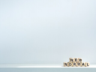 New Normal, words on wooden alphabet cube.