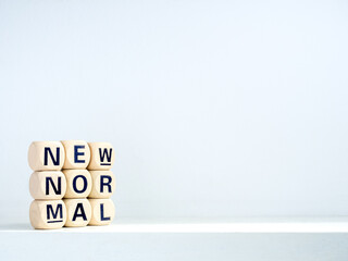 New Normal, words on wooden alphabet cube.