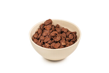 Chocolate corn flakes falling to the white bowl isolated on white. Motion.