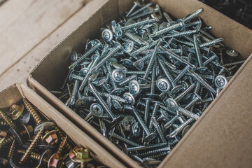 screws made od steel, Screw background on wooden background, mechanic work desk.