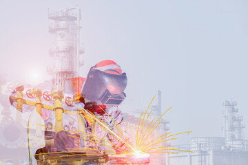 Double exposure Close-up image of industrial worker at the factory welding construction on...