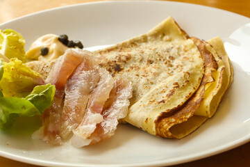 Gravlax with pancake served salad