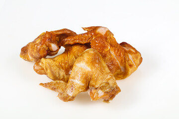 Smoked chicken wings over white background