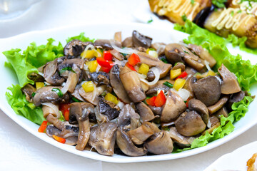 Salad of mushrooms, lettuce and sweet pepper. Festive mushroom salad.