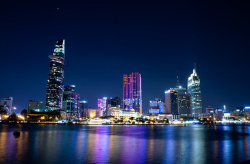 Fototapeta premium Ho Chi Minh skyline, reflection, night time, city, skyscraper
