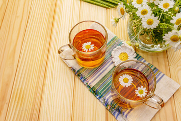 Chamomile tea. Fresh flowers, summer hot drink concept. Alternative medicine, lifestyle