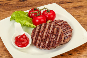 Grilled burger cutlet with sauce