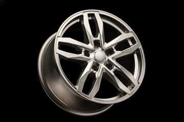 grey SUV Allloy wheel, close-up on a black background,
