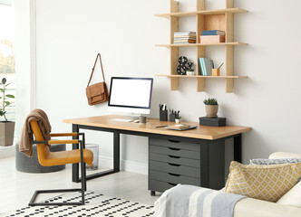 Stylish room interior with modern comfortable workplace