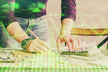 Multi exposure of man standing and planing investment with stock market forex chart.