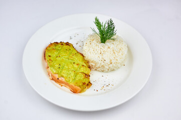 White plate with rice and and fish