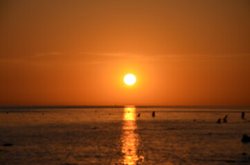 Beautiful sunset above the sea reflection of the setting sun in the water.
